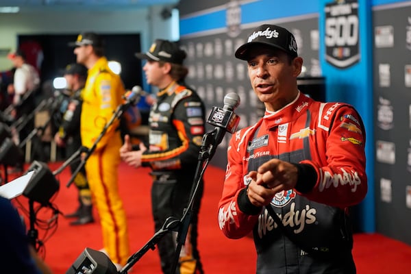 Helio Castroneves answers a question from reporters during media day at the NASCAR Daytona 500 auto race, Wednesday, Feb. 12, 2025, at Daytona International Speedway in Daytona Beach, Fla. (AP Photo/John Raoux)