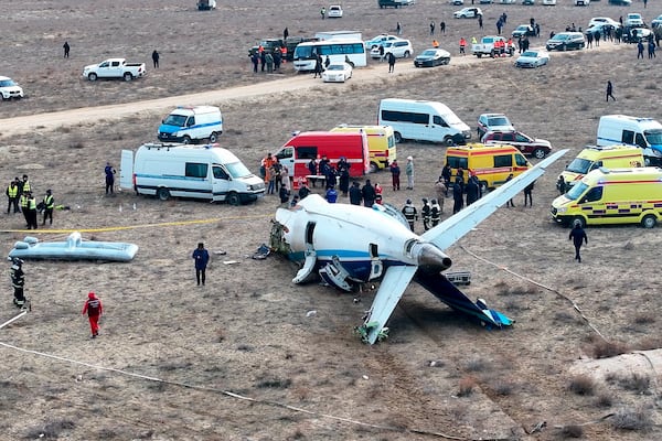 The wreckage of Azerbaijan Airlines Embraer 190 lays on the ground near the airport of Aktau, Kazakhstan, Wednesday, Dec. 25, 2024. (AP Photo/Azamat Sarsenbayev)