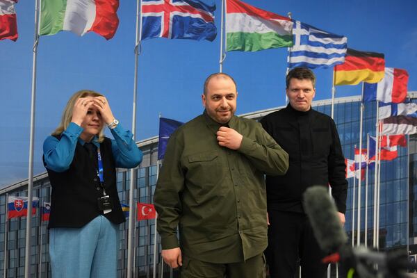 Ukraine's Defense Minister Rustem Umerov, center, prepares to speak during a media conference after a meeting of the Ukraine Defense Contact group at NATO headquarters in Brussels, Wednesday, Feb. 12, 2025. (AP Photo/Virginia Mayo)