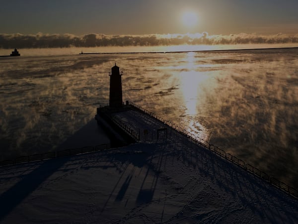 With temperatures below zero, steam rises over Lake Michigan Tuesday, Feb. 18, 2025, in Milwaukee. (AP Photo/Morry Gash)