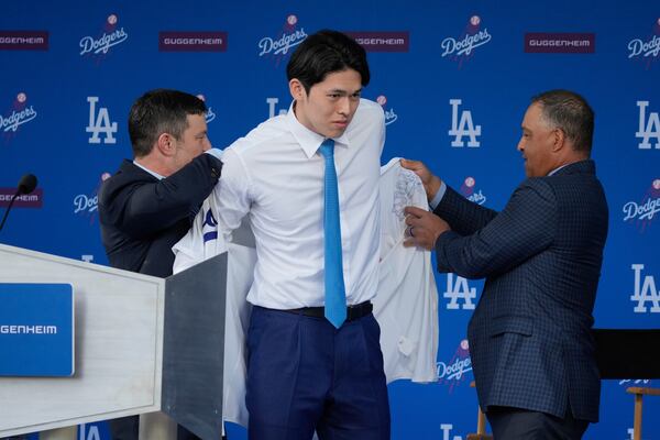 Japanese right-hander pitcher Roki Sasaki, 23, is introduced by the Los Angeles Dodgers at a news conference at Dodger Stadium Wednesday, Jan. 22, 2025 in Los Angeles. (AP Photo/Damian Dovarganes)