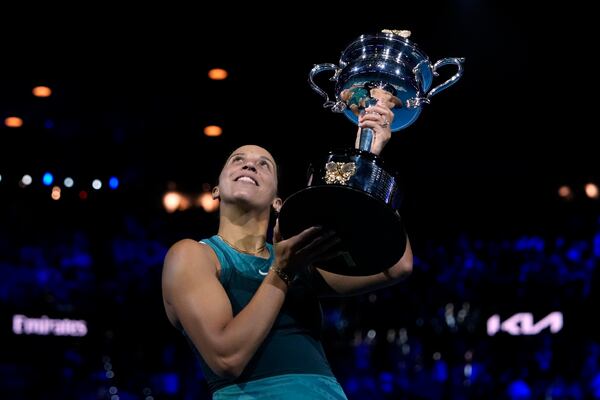 Madison Keys of the U.S. holds the Daphne Akhurst Memorial Cup aloft after defeating Aryna Sabalenka of Belarus in the women's singles final at the Australian Open tennis championship in Melbourne, Australia, Saturday, Jan. 25, 2025. (AP Photo/Asanka Brendon Ratnayake)