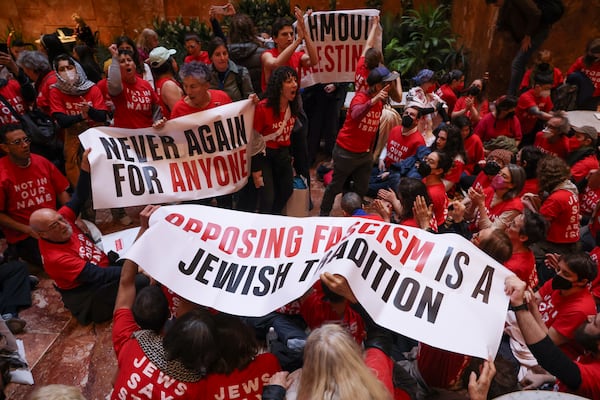 Demonstrators from the group, Jewish Voice for Peace, protest inside Trump Tower in support of Columbia graduate student Mahmoud Khalil, Thursday, March 13, 2025, in New York. (AP Photo/Yuki Iwamura)