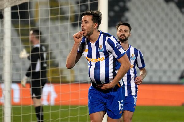 Porto's Nico Gonzalez celebrates after scoring the opening goal during the Europa League opening phase soccer match between Maccabi Tel Aviv and Porto, at the Partizan stadium, in Belgrade, Serbia, Thursday, Jan. 30, 2025. (AP Photo/Darko Vojinovic)