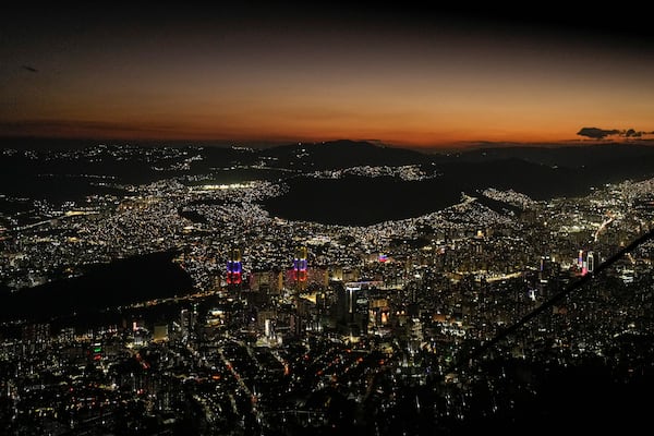 Night falls on Caracas, Venezuela, as seen from El Avila, Wednesday, Jan. 8, 2025, days ahead of President Nicolas Maduro's inauguration for a third presidential term. (AP Photo/Matias Delacroix)