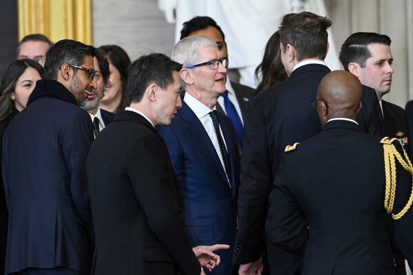 From left, Google CEO Sundar Pichai, TikTok CEO Shou Chew, Apple CEO Tim Cook and Tesla and SpaceX CEO Elon Musk speak with each other at the conclusion of the 60th Presidential Inauguration in the Rotunda of the U.S. Capitol in Washington, Monday, Jan. 20, 2025. (Saul Loeb/Pool photo via AP)