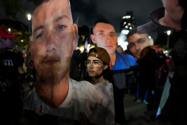 People hold photos of hostages held by Hamas in Gaza during a rally calling for their return, in Tel Aviv, Israel, Tuesday, Feb. 4, 2025, ahead of the planned meeting between U.S. President Donald Trump and Israeli Prime Minister Benjamin Netanyahu. (Photo/Ohad Zwigenberg)