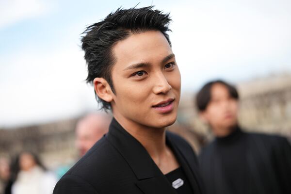 Mingyu poses for photographers at the Dior Fall/Winter 2025-2026 Womenswear collection presented Tuesday, March 4, 2025. in Paris. (Photo by Scott A Garfitt/Invision/AP)