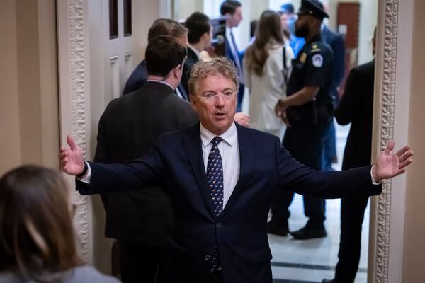 Sen. Rand Paul, R-Ky., gestures as he leaves after Senate Republicans met with Elon Musk, at the Capitol in Washington, Wednesday, March 5, 2025. (AP Photo/Ben Curtis)