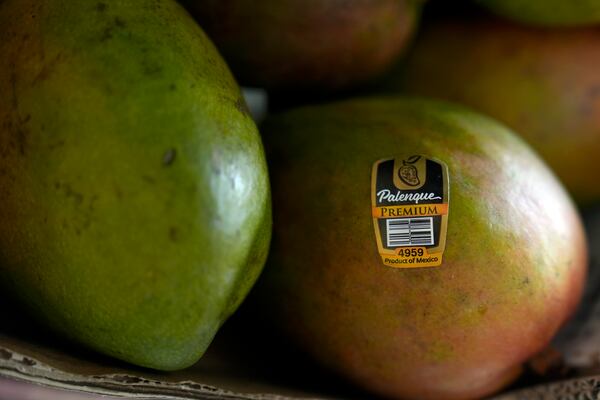 Mangoes for sale are displayed at a grocery store in San Francisco, Wednesday, March 5, 2025. (AP Photo/Jeff Chiu)