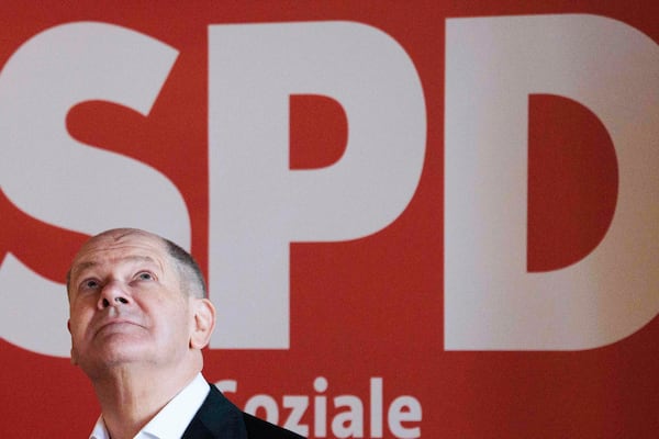 German Chancellor Olaf Scholz of the Social Democratic Party (SPD) looks up from the stage at a citizens' dialog in Brandenburg, Germany, Saturday, Feb. 22, 2025 one day ahead of the national election. (Carsten Koall/dpa via AP)