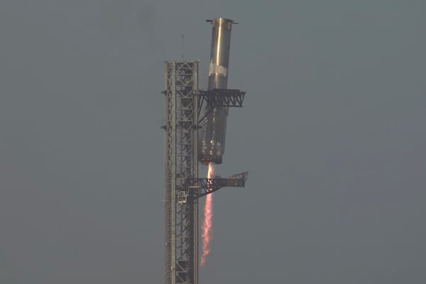 The booster of SpaceX's mega rocket Starship is recaptured during a test flight from Starbase in Boca Chica, Texas, Thursday, March 6, 2025. (AP Photo/Eric Gay)