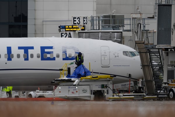 A United Airlines plane is parked at the closed George Bush Intercontinental Airport Tuesday, Jan. 21, 2025, in Houston. (AP Photo/David J. Phillip)