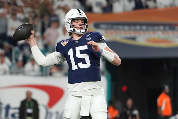 Penn State quarterback Drew Allar (15) throws for a touchdown during the first half of the Orange Bowl NCAA College Football Playoff semifinal game against Notre Dame, Thursday, Jan. 9, 2025, in Miami Gardens, Fla. (AP Photo/Rebecca Blackwell)