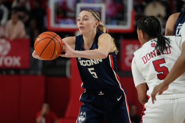 UConn's Paige Bueckers (5) passes away from St. John's Jailah Donald (5) during the second half of an NCAA women's college basketball game, Wednesday, Jan. 15, 2025, in New York. (AP Photo/Frank Franklin II)