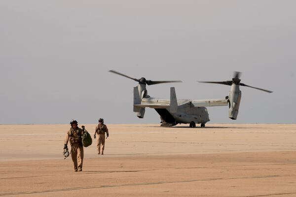 U.S. Marine pilots land an Osprey at the Naval Outlying Landing Field Friday, Jan. 31, 2025, in Imperial Beach, Calif. (AP Photo/Jae C. Hong)