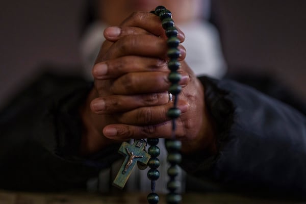 A Catholic nun attends a prayer of the Rosary for Pope Francis in St. Peter's Square at The Vatican, Monday, Feb. 24, 2025. (AP Photo/Bernat Armangue)