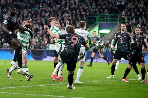 Bayern's Harry Kane scores his side's second goal during the Champions League play off first leg soccer match between Celtic Glasgow and Bayern Munich at the Celtic Park Stadium in Glasgow, Scotland, Wednesday, Feb. 12, 2025. (AP Photo/Scott Heppell)