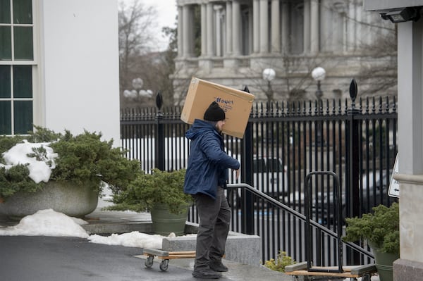 Movers load trucks at the White House grounds two days before Inauguration Day and a new administration, in Washington, Saturday, Jan. 18, 2025. (AP Photo/Rod Lamkey, Jr.)