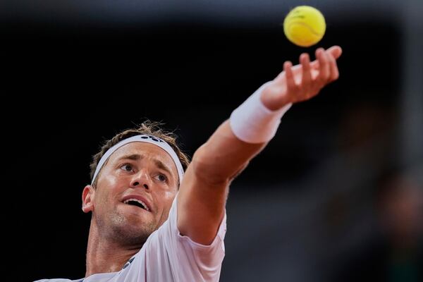 Casper Ruud of Norway serves against Francisco Cerundolo from Argentina during men's semifinal at the Madrid Open tennis tournament in Madrid, Spain, Friday, May 2, 2025. (AP Photo/Manu Fernandez)