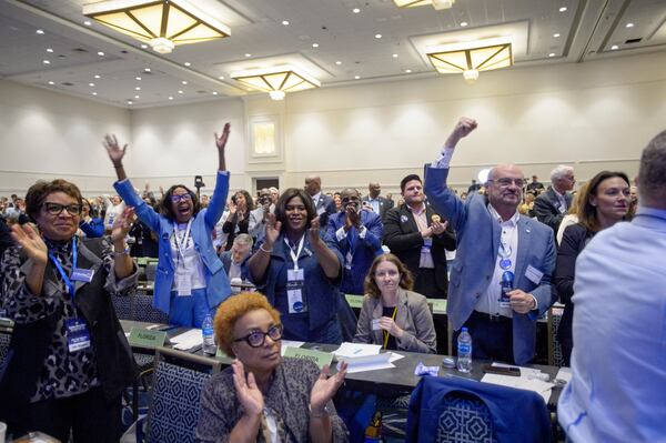 Attendees cheer as Ken Martin is announced as the newly elected Democratic National Committee Chairman after winning the vote at the Democratic National Committee Winter Meeting at the Gaylord National Resort and Convention Center in National Harbor, Md., Saturday, Feb. 1, 2025. (AP Photo/Rod Lamkey, Jr.)