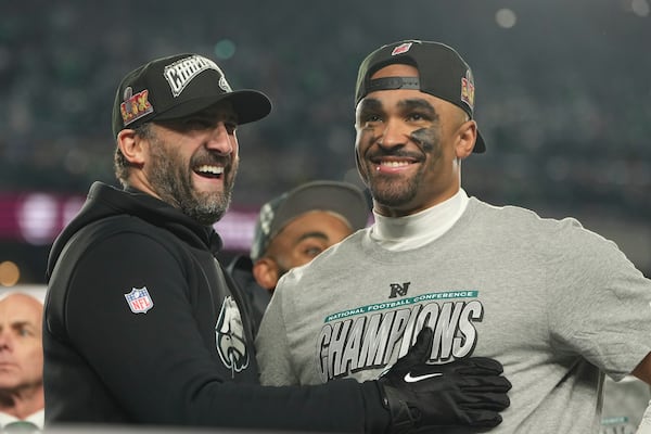 Philadelphia Eagles coach Nick Sirianni, left, and quarterback Jalen Hurts celebrate after the Eagles won the NFC Championship NFL football game against the Washington Commanders, Sunday, Jan. 26, 2025, in Philadelphia. (AP Photo/Matt Slocum)