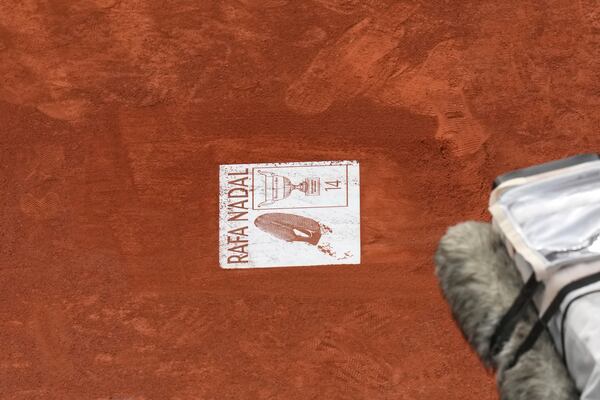 A sign for Rafa Nadal is placed during a farewell ceremony at center court Philippe-Chatrier, at the Roland-Garros stadium, in Paris, Sunday May 25, 2025. (AP Photo/Christophe Ena)