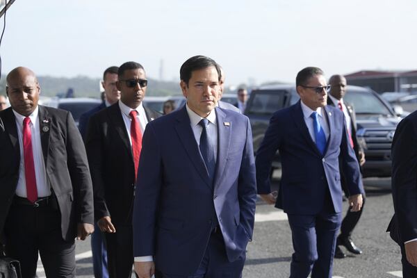 Secretary of State Marco Rubio, with Frank Alexis Abrego, Panama's Minister of Public Security, right, arrive to watch people board a repatriation flight bound for Colombia at Albrook Airport in Panama City, Monday, Feb. 3, 2025. (AP Photo/Mark Schiefelbein, Pool)