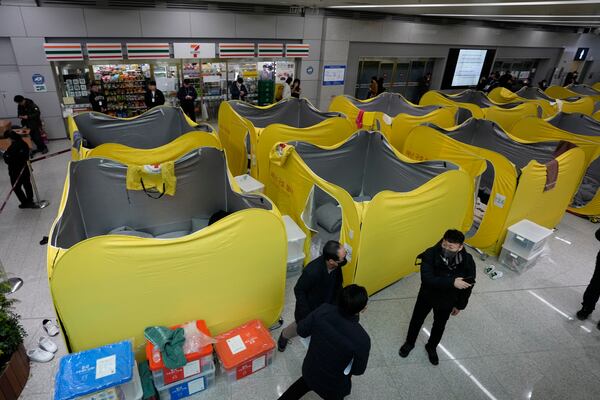 A temporary shelter for relatives of the passengers of a plane which burst into flames, is seen at Muan International Airport in Muan, South Korea, Monday, Dec. 30, 2024. (AP Photo/Ahn Young-joon)