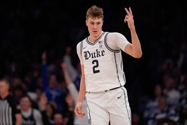 Duke's Cooper Flagg (2) gestures after making a three-point shot during the second half of an NCAA college basketball game against Illinois Saturday, Feb. 22, 2025, in New York. (AP Photo/Frank Franklin II)