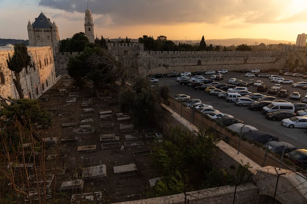 Cars are parked in a parking area known as "Cows garden" at the Armenian quarter in Jerusalem, Thursday, Nov. 21, 2024. (AP Photo/Francisco Seco)