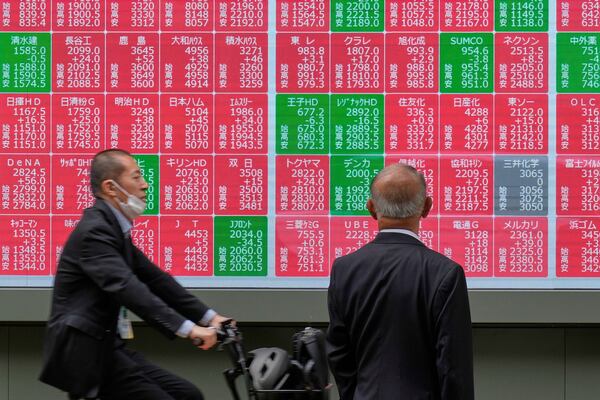A person looks at an electronic stock board showing Japan's Nikkei index at a securities firm Monday, May 26, 2025, in Tokyo. (AP Photo/Eugene Hoshiko)