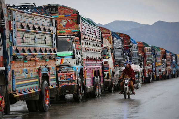 Trucks wait to cross the closed Torkham border with Pakistan, where Pakistani and Afghan forces exchanged fire overnight, in Torkham, Afghanistan, Monday, March 3, 2025.(AP Photo/Shafiullah Kakar)