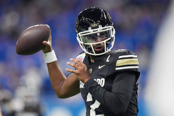 Colorado quarterback Shedeur Sanders (2) warms up for the Alamo Bowl NCAA college football game against BYU, Saturday, Dec. 28, 2024, in San Antonio. (AP Photo/Eric Gay)