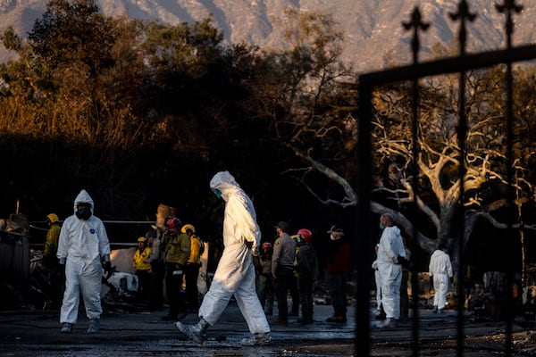 A search team looks for victims' remains at a home destroyed by the Eaton Fire in Altadena, Calif., Saturday, Jan. 11, 2025. (Stephen Lam/San Francisco Chronicle via AP)