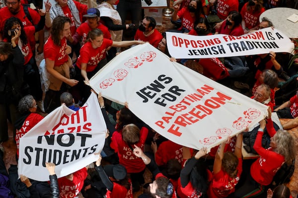 Demonstrators from the group, Jewish Voice for Peace, protest inside Trump Tower in support of Columbia graduate student Mahmoud Khalil, Thursday, March 13, 2025, in New York. (AP Photo/Yuki Iwamura)