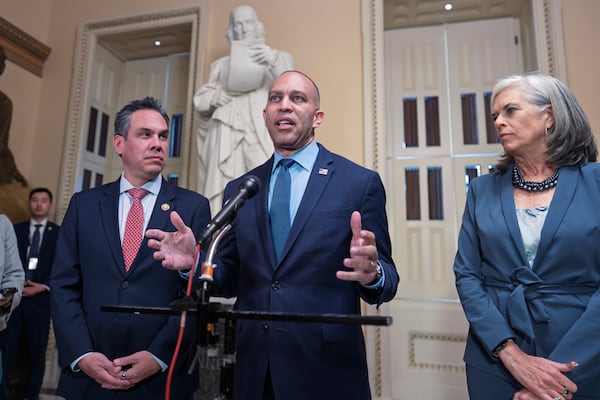 House Minority Leader Hakeem Jeffries, D-N.Y., center, flanked by Rep. Pete Aguilar, D-Calif., left, and Rep. Katherine Clark, D-Mass., the House minority whip, speaks to reporters outside the House chamber as Republicans prepare a spending bill that would keep federal agencies funded through Sept. 30, at the Capitol, in Washington, Monday, March 10, 2025. (AP Photo/J. Scott Applewhite)