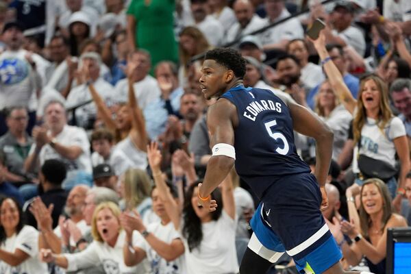 Minnesota Timberwolves guard Anthony Edwards (5) celebrates after scoring during the second half of Game 5 of an NBA basketball second-round playoff series against the Golden State Warriors, Wednesday, May 14, 2025, in Minneapolis. (AP Photo/Abbie Parr)
