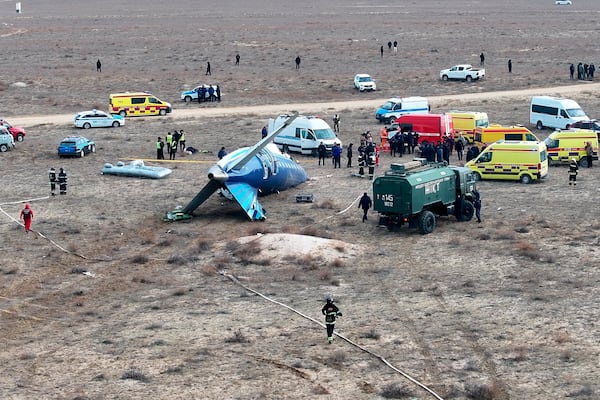 The wreckage of Azerbaijan Airlines Embraer 190 lays on the ground near the airport of Aktau, Kazakhstan, Wednesday, Dec. 25, 2024. (AP Photo/Azamat Sarsenbayev)