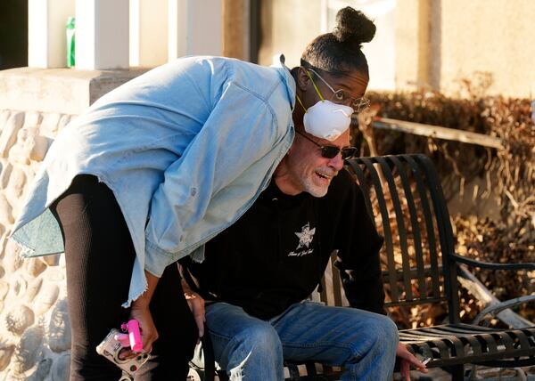 FILE - Sam Baum, right, community relations director at the Terraces at Park Marino assisted living facility, is consoled by Activities Director Lashawna Thompson after seeing the damage the Eaton Fire did to the facility on Monday, Jan. 13, 2025, in Pasadena, Calif. (AP Photo/Chris Pizzello, File)