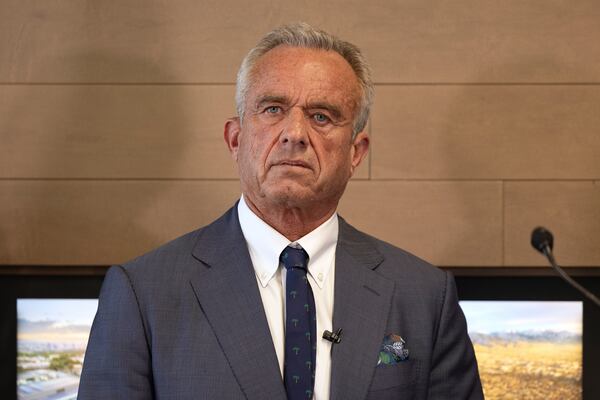 Health and Human Services Secretary Robert F. Kennedy Jr. looks on during a press conference about Utah's new fluoride ban, food additives and SNAP funds legislation, Monday, April 7, 2025, in Salt Lake City. (AP Photo/Melissa Majchrzak)