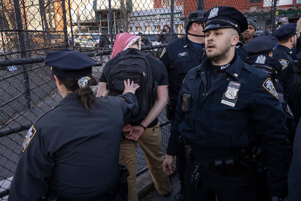 New York Police Department officers detain a protester during a demonstration in support of Palestinian activist Mahmoud Khalil, Monday, March 10, 2025, in New York. (AP Photo/Yuki Iwamura)