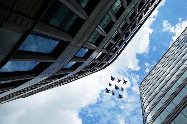 Russian Sukhoi Su-30SM jet fighters of The Russian Knights aerobatic team and Mikoyan MiG-29 jet fighters of The Swifts aerobatic team fly towards the Red Square for the Victory Day military parade general rehearsal in Moscow, Russia, Wednesday, May 7, 2025. (AP Photo/Pavel Bednyakov)