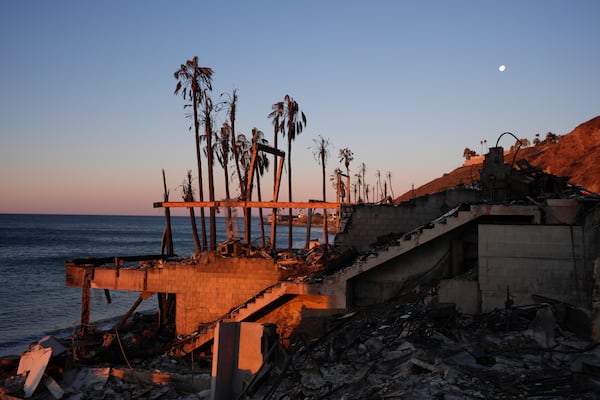 A beach front home destroyed by the Palisades Fire is seen in Malibu, Calif., Wednesday, Jan. 15, 2025. (AP Photo/Jae C. Hong)