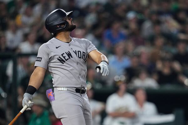 New York Yankees' Jasson Domínguez watches his sacrifice fly during the fifth inning of a baseball game against the Athletics, Friday, May 9, 2025, in West Sacramento, Calif. (AP Photo/Godofredo A. Vásquez)