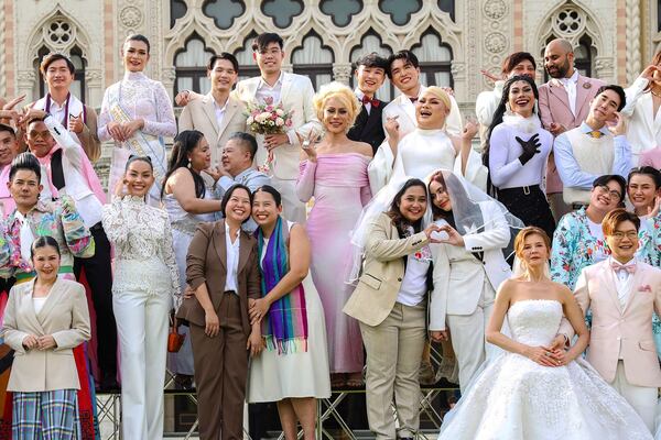 A group of LGBTQ pose for a picture as a part of celebration of a marriage equality bill at Government house in Bangkok, Thailand, on Jan. 15, 2025. (AP Photo/Jirasak jivawavatanawanit)