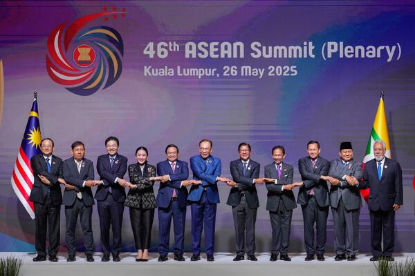 ASEAB leaders chain their hands while posing for a picture before the start of the plenary session at the Association of Southeast Asian Nations (ASEAN) Summit in Kuala Lumpur, Malaysia, Monday, May 26, 2025. From left to right, Laos's Prime Minister Sonexay Siphandone, Myanmar Permanent Secretary of the Ministry of Foreign Affairs Aung Kyaw Moe, Singapore's Prime Minister Lawrence Wong, Thailand's Prime Minister Paetongtarn Shinawatra, Vietnam's Prime Minister Pham Minh Chinh, Malaysia's Prime Minister Anwar Ibrahim, Philippine's President Ferdinand Marcos Jr., Brunei's Sultan Hassanal Bolkiah, Cambodian Prime Minister Hun Manet, Indonesia's President Prabowo Subianto and East Timor's Prime Minister Xanana Gusmao. (AP Photo/Vincent Thian)