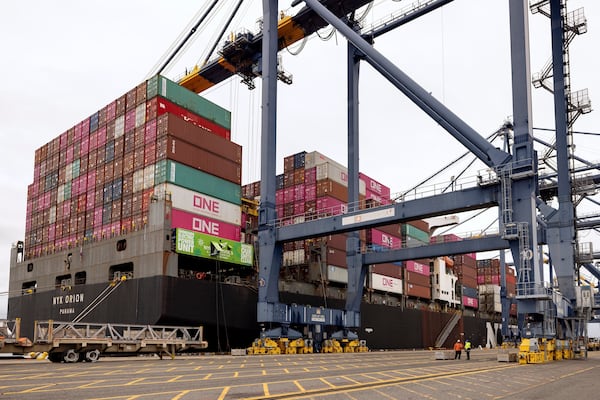 A cargo ship is plugged in to an electric grid rather than burning diesel at the Yusen Terminal in the Port of Los Angeles, Tuesday, March 11, 2025, in San Pedro, Calif. (AP Photo/Etienne Laurent)