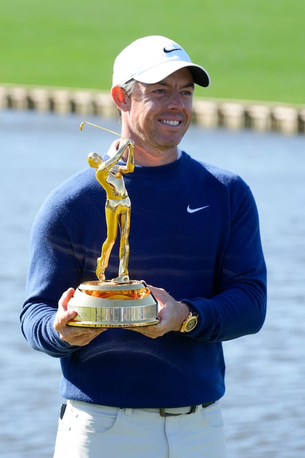 Rory McIlroy, of Northern Ireland, poses for a photo with his trophy after winning a playoff round of The Players Championship golf tournament Monday, March 17, 2025, in Ponte Vedra Beach, Fla. (AP Photo/Chris O'Meara)