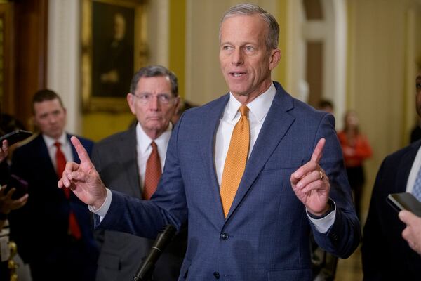 Sen. John Barrasso, R-Wyo., left, listens while Senate Majority Leader John Thune, R-S.D., speaks following the Senate Republican policy luncheon at the Capitol, Tuesday, Feb. 4, 2025, in Washington. (AP Photo/Rod Lamkey, Jr.)